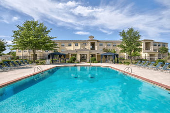 Resort-style swimming pool with cabanas